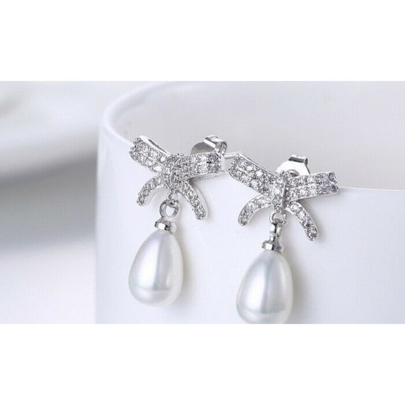 Unbranded Jewelry - 18K White Gold Plated Pave Bow Dangle Earrings